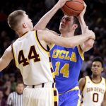 UCLA forward Gyorgy Goloman (14) shoots over Arizona State guard Kodi Justice (44) during the first half of an NCAA college basketball game, Thursday, Feb. 23, 2017, in Tempe, Ariz. (AP Photo/Matt York)