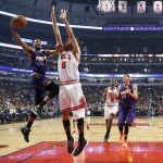 Phoenix Suns' TJ Warren, left, drives on Chicago Bulls' Robin Lopez during the first half of an NBA basketball game Friday, Feb. 24, 2017, in Chicago. (AP Photo/Charles Rex Arbogast)