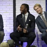 Walter Payton NFL Man of the Year finalists New York Giants' Eli Manning, left, Arizona Cardinals' Larry Fitzgerald, center, and Carolina Panthers' Greg Olsen, take part in a fan forum for the NFL Super Bowl 51 football game Friday, Feb. 3, 2017, in Houston. (AP Photo/David J. Phillip)