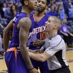 Phoenix Suns forward Marquese Chriss, left, shouts at players of the Memphis Grizzlies as he is held back by forward Derrick Jones Jr. (10) and referee Tyler Ford during an altercation on the court in the second half of an NBA basketball game Wednesday, Feb. 8, 2017, in Memphis, Tenn. (AP Photo/Brandon Dill)