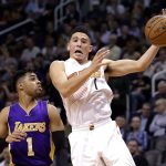 Phoenix Suns guard Devin Booker, right, loses the ball as Los Angeles Lakers guard D'Angelo Russell defends during the second half of an NBA basketball game, Wednesday, Feb. 15, 2017, in Phoenix. (AP Photo/Matt York)