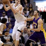 Phoenix Suns center Alex Len (21) pulls in the ball next to Los Angeles Lakers forward Larry Nance Jr. (7) during the first half of an NBA basketball game, Wednesday, Feb. 15, 2017, in Phoenix. (AP Photo/Matt York)