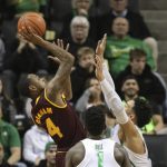 Arizona State's Torian Graham, left, shoots over Oregon's Jordan Bell, center, and Dillon Brooks during the first half of an NCAA college basketball game Thursday, Feb. 2, 2017, in Eugene, Ore. (AP Photo/Chris Pietsch)