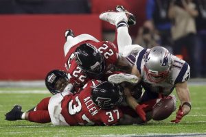 New England Patriots' Julian Edelman makes a catch as Atlanta Falcons' Ricardo Allen and Keanu Neal defend, during the second half of the NFL Super Bowl 51 football game Sunday, Feb. 5, 2017, in Houston. (AP Photo/Patrick Semansky)