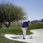 Graham DeLaet hits onto the green from the sixth fairway bunker during the final round of the Waste Management Phoenix Open golf tournament, Sunday, Feb. 5, 2017, in Scottsdale, Ariz. (AP Photo/Matt York)