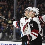 Arizona Coyotes left wing Brendan Perlini, of Great Britain, celebrates his goal with center Christian Dvorak during the third period of an NHL hockey game against the Los Angeles Kings, Thursday, Feb. 16, 2017, in Los Angeles. The Coyotes won 5-3. (AP Photo/Mark J. Terrill)