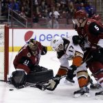 Arizona Coyotes goalie Mike Smith (41) makes the save on Anaheim Ducks center Ryan Kesler (17) as Connor Murphy (5) defends from behind in the first period during an NHL hockey game, Monday, Feb. 20, 2017, in Glendale, Ariz. (AP Photo/Rick Scuteri)