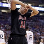 Chicago Bulls forward Doug McDermott (11) reacts during the second half of the team's NBA basketball game against the Phoenix Suns, Friday, Feb. 10, 2017, in Phoenix. (AP Photo/Matt York)