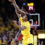 Stanford guard Marcus Allen, rear, and Arizona State guard Shannon Evans II leap for the ball during the first half of an NCAA college basketball game, Saturday, Feb. 11, 2017, in Tempe, Ariz. (AP Photo/Matt York)