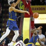 California's Stephen Domingo, left, blocks the shot of Arizona State guard Tra Holder (0) as California's guard Jabari Bird, right, watches during the first half of an NCAA college basketball game Wednesday, Feb. 8, 2017, in Tempe, Ariz. (AP Photo/Ross D. Franklin)