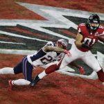 Atlanta Falcons' Austin Hooper catches a touchdown pass ahead of New England Patriots' Patrick Chung during the first half of the NFL Super Bowl 51 football game Sunday, Feb. 5, 2017, in Houston. (AP Photo/Charlie Riedel)