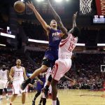 Phoenix Suns' Devin Booker (1) loses the ball as Houston Rockets' Clint Capela (15) defends during the first half of an NBA basketball game, Saturday, Feb. 11, 2017, in Houston. (AP Photo/David J. Phillip)