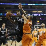 Sacramento Kings forward DeMarcus Cousins, second from left, goes to the basket against Phoenix Suns center Tyson Chandler during the first half of an NBA basketball game Friday, Feb. 3, 2017, in Sacramento, Calif. (AP Photo/Rich Pedroncelli)