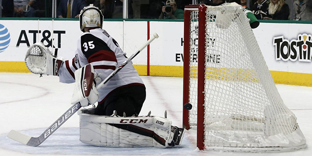 Arizona Coyotes goalie Louis Domingue is unable to stop the shot from Dallas Stars' Cody Eakin duri...