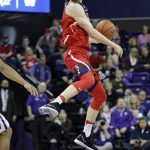 Arizona's Lauri Markkanen leaps at the half-court line to prevent a call of over and back during the first half of the team's NCAA college basketball game against Washington on Saturday, Feb. 18, 2017, in Seattle. (AP Photo/Elaine Thompson)