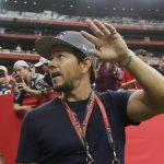 Mark Wahlberg waves as he arrives before the NFL Super Bowl 51 football game between the New England Patriots and the Atlanta Falcons, Sunday, Feb. 5, 2017, in Houston. (AP Photo/Elise Amendola)