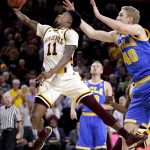 Arizona State guard Shannon Evans II (11) drives past UCLA center Thomas Welsh (40) during the second half of an NCAA college basketball game, Thursday, Feb. 23, 2017, in Tempe, Ariz. (AP Photo/Matt York)
