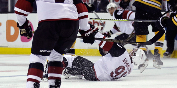 Arizona Coyotes center Alexander Burmistrov (91) is dropped to the ice on a charge by Boston Bruins...