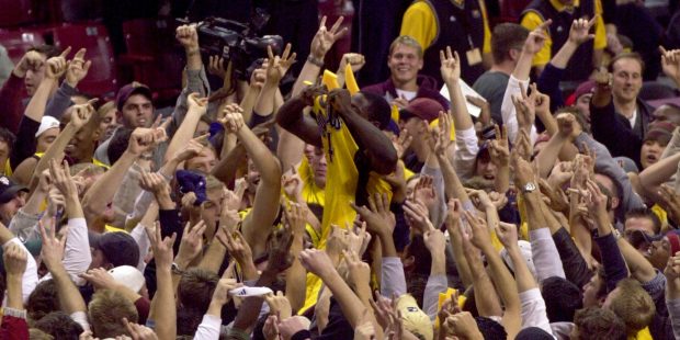 Arizona State guard Curtis Millage, center, lifts his shirt as he is raised onto the shoulders of j...