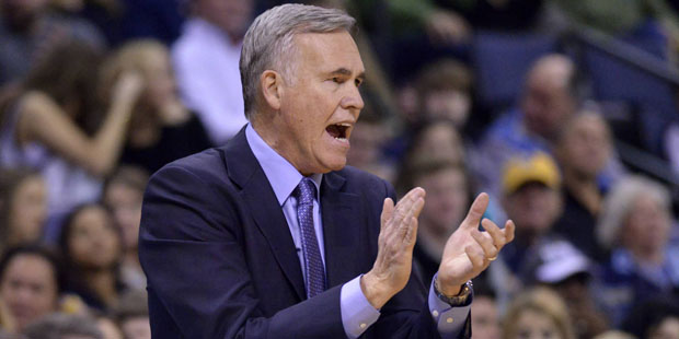 Houston Rockets coach Mike D'Antoni applauds during the first half of the team's NBA basketball gam...