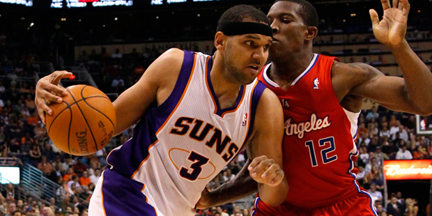 Phoenix Suns' Jared Dudley (3) drives against Los Angeles Clippers' Eric Bledsoe (12) during the se...