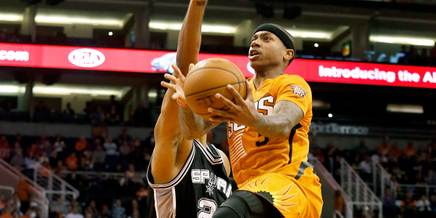 Phoenix Suns guard Isaiah Thomas (3) drives past San Antonio Spurs forward Tim Duncan (21) in the s...
