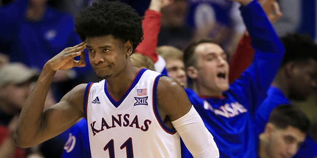 Kansas guard Josh Jackson (11) salutes his teammates after a three-point basket during the second h...