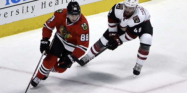Chicago Blackhawks right wing Patrick Kane (88) is defended by Arizona Coyotes left wing Jordan Mar...
