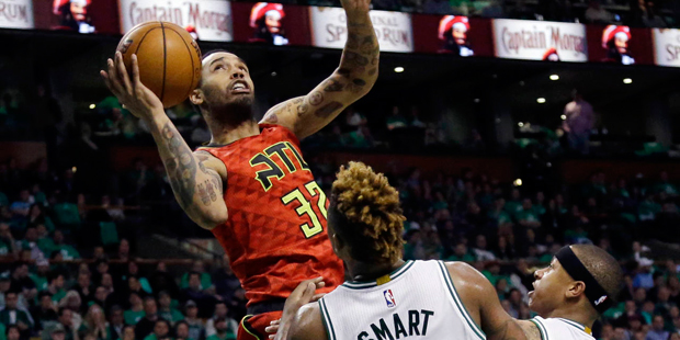 Atlanta Hawks forward Mike Scott (32) goes up to shoot against Boston Celtics guards Marcus Smart (...