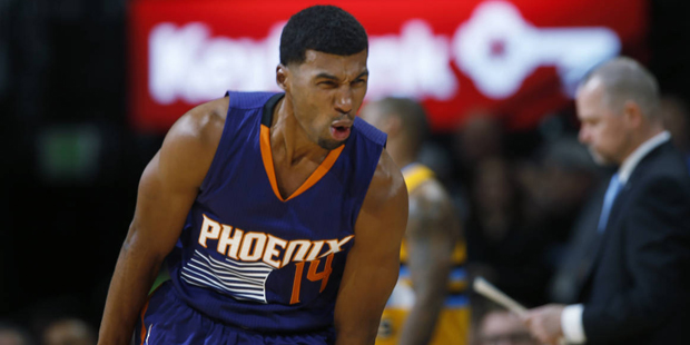 Phoenix Suns guard Ronnie Price reacts after hitting key shot against the Denver Nuggets late in th...
