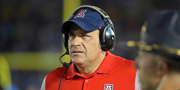 Arizona head coach Rich Rodriguez works the sideline against UCLA in the first half of an NCAA coll...