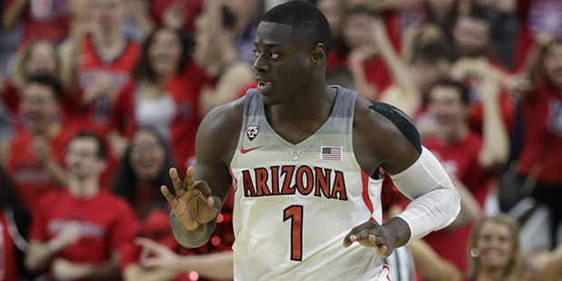 Arizona's Rawle Alkins reacts after scoring a 3-point shot against Arizona during the second half o...