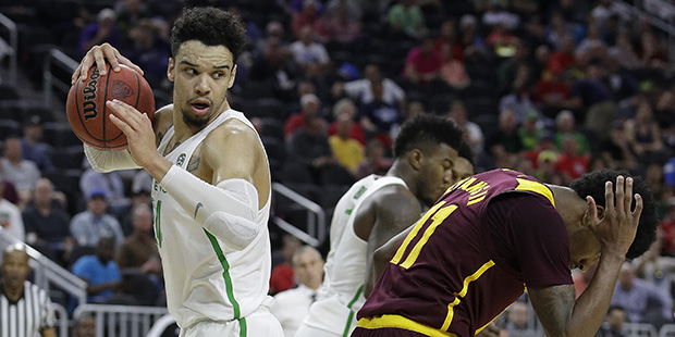 Oregon's Dillon Brooks, left, grabs a rebound over Arizona State's Shannon Evans II, right, during ...