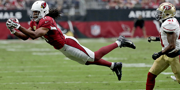 Arizona Cardinals wide receiver Larry Fitzgerald (11) makes a diving catch as San Francisco 49ers s...