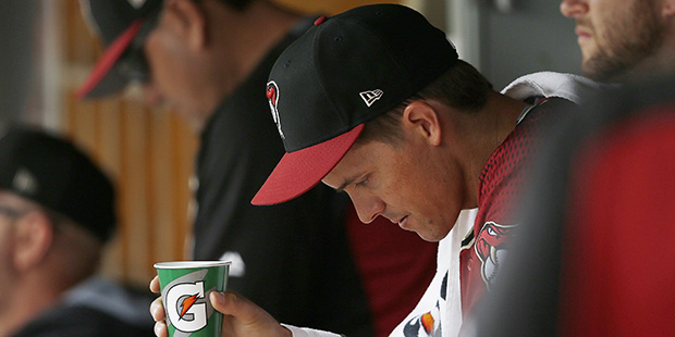 Arizona Diamondbacks' Zack Greinke sits in the dugout after pitching in the first inning of a sprin...