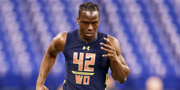 Washington wide receiver John Ross runs the 40-yard dash in 4.22 seconds to set a new record at the...