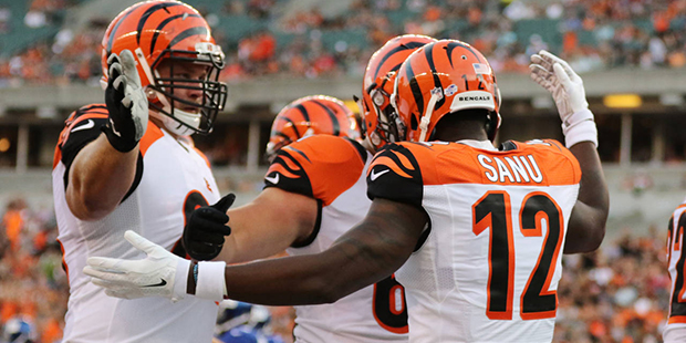 Cincinnati Bengals wide receiver Mohamed Sanu (12) celebrates his touchdown with guard Kevin Zeitle...