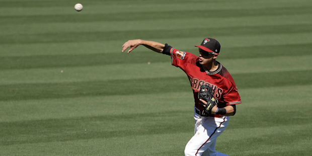 Arizona Diamondbacks' Nick Ahmed throws out Texas Rangers' Joey Gallo during the fourth inning of a...