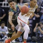 North Dakota guard Geno Crandall (0) defends against Arizona guard Allonzo Trier (35) during the first half of a first-round game in the NCAA men's college basketball tournament Thursday, March 16, 2017, in Salt Lake City. (AP Photo/Rick Bowmer)