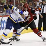 Arizona Coyotes defenseman Connor Murphy (5) and St. Louis Blues left wing Alexander Steen (20) battle for the puck during the second period of an NHL hockey game Saturday, March 18, 2017, in Glendale, Ariz. (AP Photo/Ross D. Franklin)
