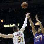 Phoenix Suns' Jared Dudley, right, shoots against Atlanta Hawks' Mike Muscala in the first quarter of an NBA basketball game in Atlanta, Tuesday, March 28, 2017. (AP Photo/David Goldman)