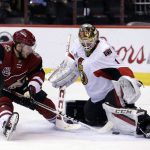 Ottawa Senators goalie Mike Condon (1) makes the save on Arizona Coyotes right wing Tobias Rieder during the second period of an NHL hockey game, Thursday, March 9, 2017, in Glendale, Ariz. (AP Photo/Rick Scuteri)