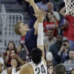 Arizona's Lauri Markkanen shoots over Oregon's Dillon Brooks during the first half of an NCAA college basketball game in the championship of the Pac-12 men's tournament Saturday, March 11, 2017, in Las Vegas. (AP Photo/John Locher)