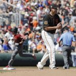 San Francisco Giants' Matt Moore walks back to the mound after giving up a solo home run to Arizona Diamondbacks' A.J. Pollock during the first inning of a spring training baseball game, Sunday, March 12, 2017, in Scottsdale, Ariz. (AP Photo/Darron Cummings)