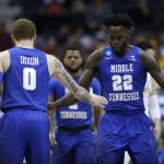 Middle Tennessee State's JaCorey Williams (22) and Tyrik Dixon (0) celebrate during the second half of an NCAA college basketball tournament first round game against Minnesota Thursday, March 16, 2017, in Milwaukee. (AP Photo/Kiichiro Sato)