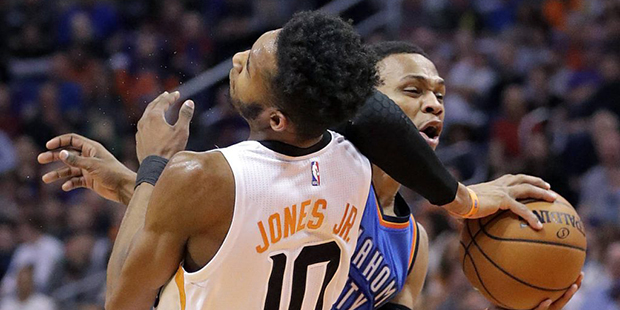 Oklahoma City Thunder guard Russell Westbrook fouls Phoenix Suns forward Derrick Jones Jr. (10) dur...