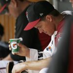 Arizona Diamondbacks' Zack Greinke sits in the dugout after pitching in the first inning of a spring training baseball game against the Chicago Cubs Thursday, March 23, 2017, in Scottsdale, Ariz. (AP Photo/Ross D. Franklin)