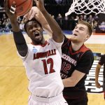 Louisville's Mangok Mathiang, left, heads to the basket as Jacksonville State's Norbertas Giga defends during the first half of a first-round game in the men's NCAA college basketball tournament Friday, March 17, 2017, in Indianapolis, Mo. (AP Photo/Jeff Roberson)