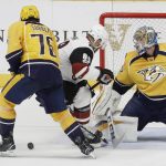 Nashville Predators defenseman P.K. Subban (76) and Arizona Coyotes left wing Jamie McGinn (88) look for the rebound after Nashville Predators goalie Pekka Rinne, of Finland, right, blocked a shot during the second period of an NHL hockey game Monday, March 20, 2017, in Nashville, Tenn. (AP Photo/Mark Humphrey)