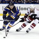 St. Louis Blues' Jaden Schwartz (17) and Arizona Coyotes' Tobias Rieder chase after a loose puck during the second period of an NHL hockey game, Monday, March 27, 2017, in St. Louis. (AP Photo/Jeff Roberson)